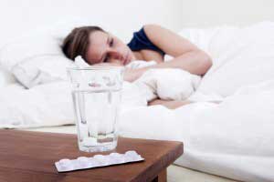 Woman feeling sick sleeping