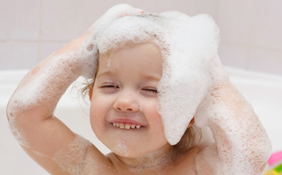 A small boy having bath