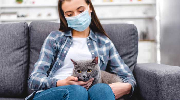 A girl seating her pet at the pet clinic