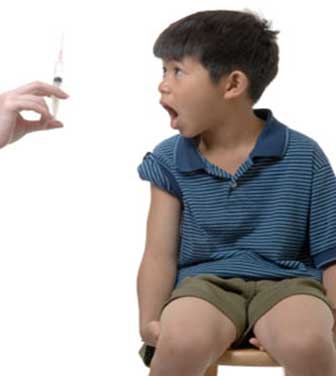 A boy getting scared from injection