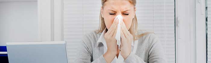 A girl sneezing