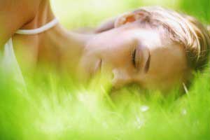 A girl sleeping on grass