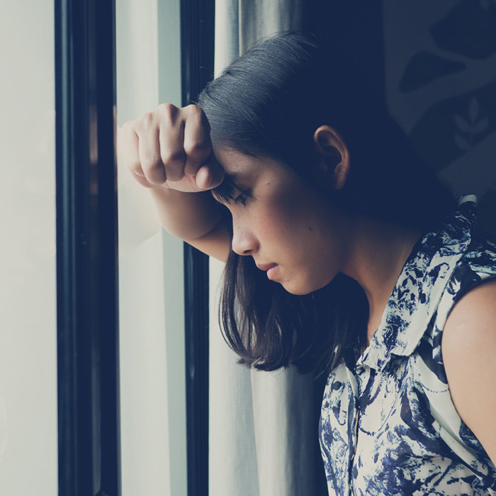 woman frustrated at window