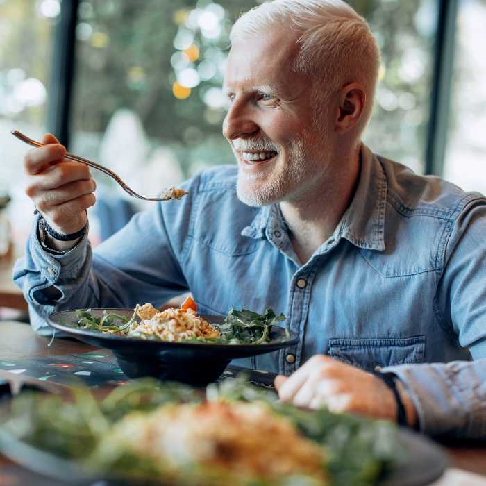 guy eating seafood